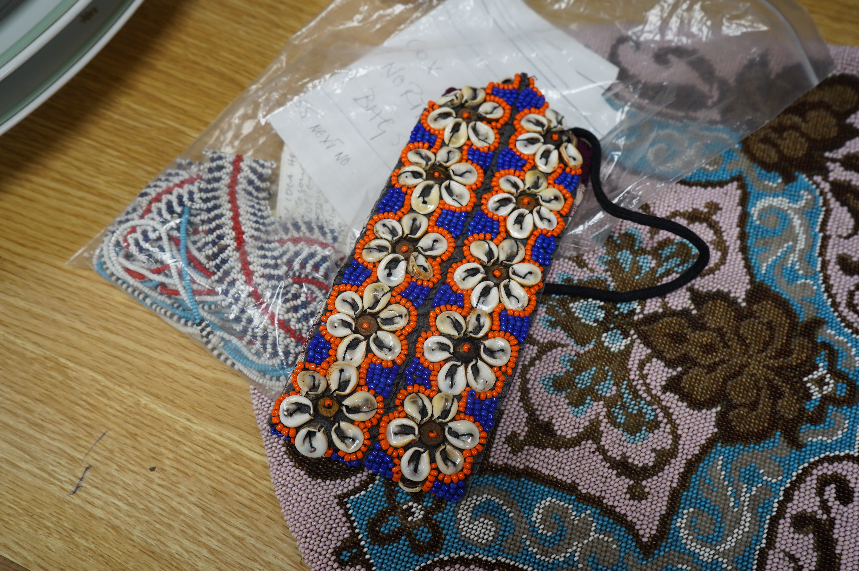 A 19th century unused Berlin beadwork tea cosy, worked in pink, turquoise, brown and white beads, beaded on two sides, the sides still joined. Ideal to convert as a cushion cover or two matching cushion covers, 55cm (tot